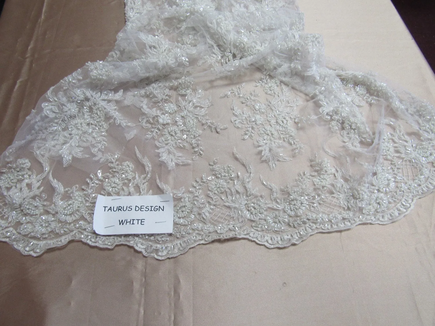 Gorgeous white French design embroider and beaded on a mesh lace. Wedding/Bridal/Prom/Nightgown fabric.