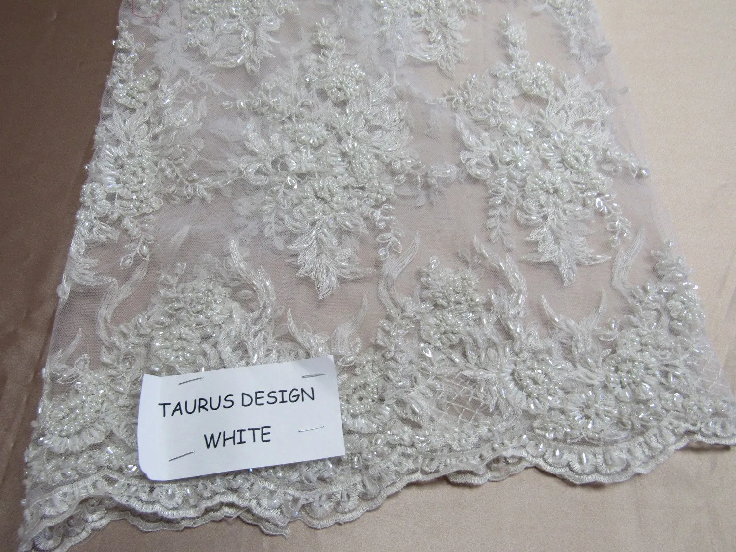 Gorgeous white French design embroider and beaded on a mesh lace. Wedding/Bridal/Prom/Nightgown fabric.