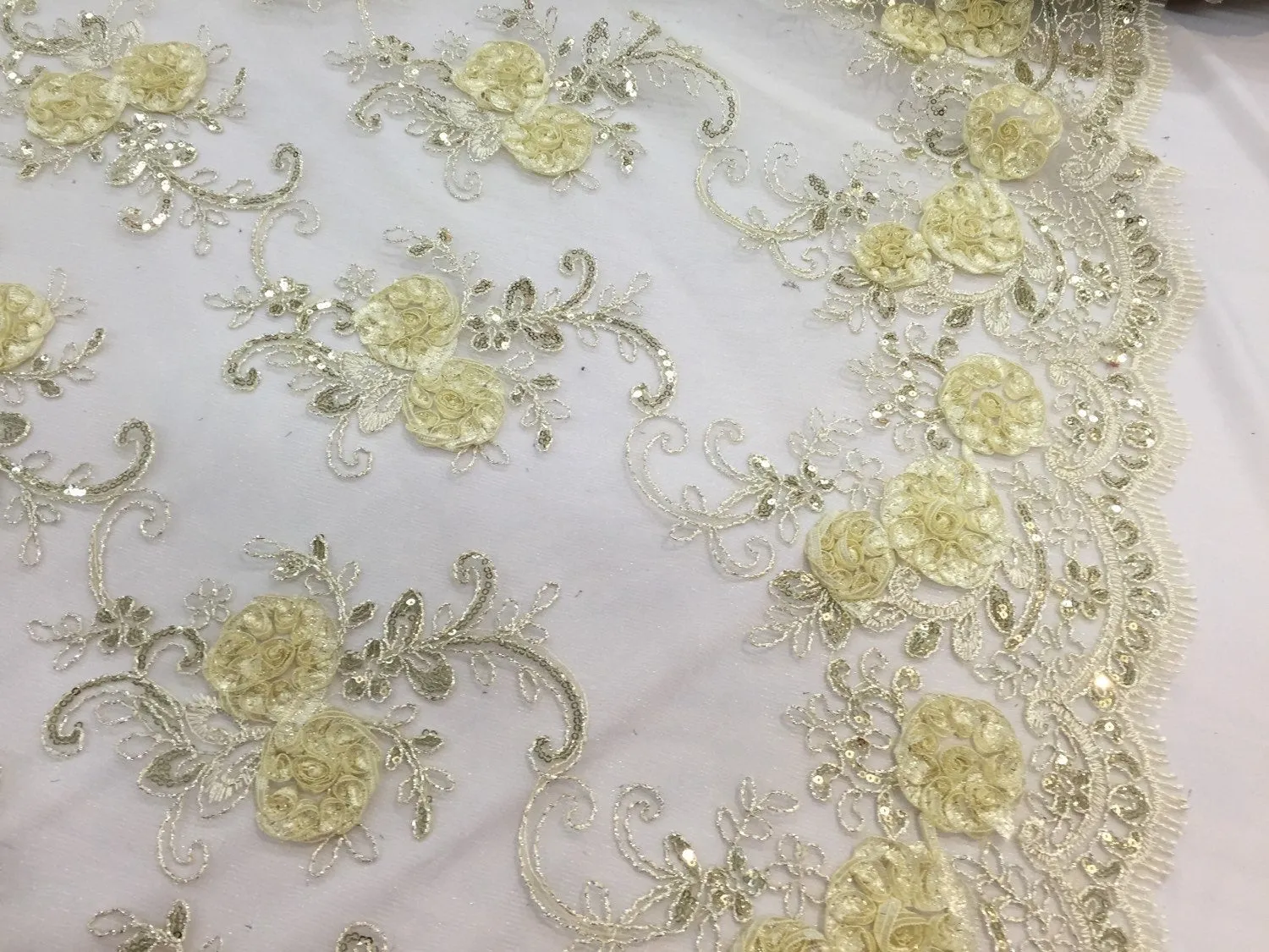 Ivory 3d flowers embroider with sequins on a mesh lace fabric. Sold by the yard.